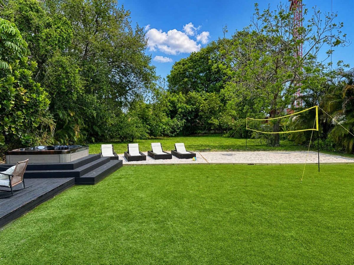 North Miami backyard after renovation with spa and sport court